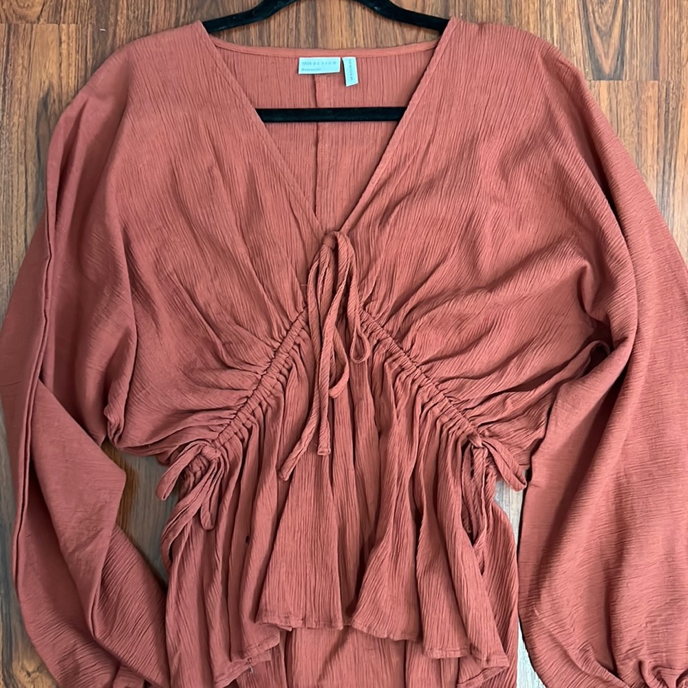 Terracotta long sleeve blouse.